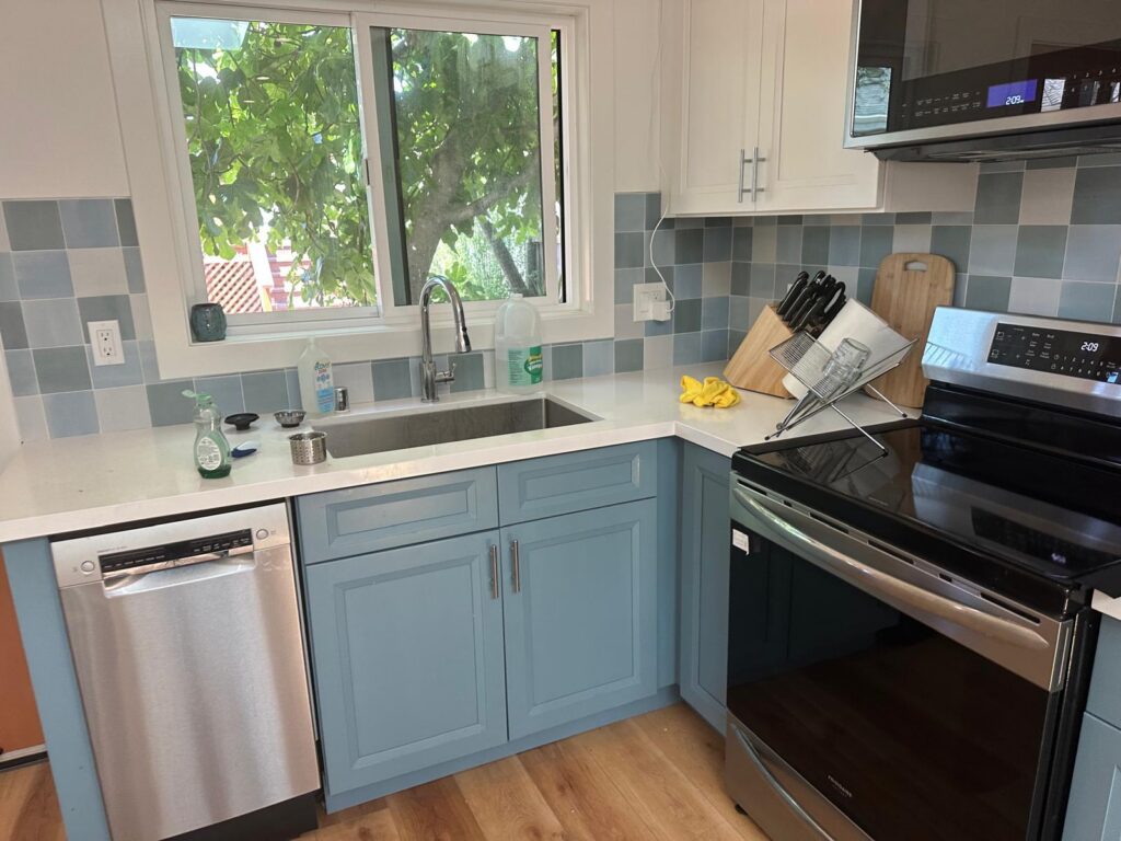 Velura Clean deep cleaning in Ocoee FL – professional cleaner scrubbing tile grout in a bright kitchen.