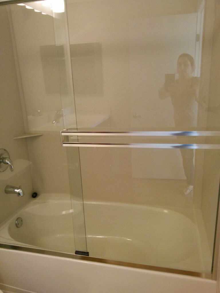 Velura Clean deep cleaning team scrubbing tile grout and baseboards in a Clermont, FL home – removing built‑up dirt and hard water stains